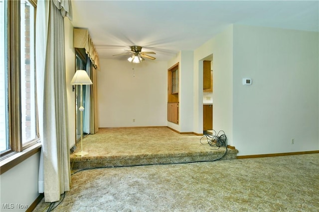 3763 E River Rd, Newton Falls, OH 44444 - empty room with carpet, a ceiling fan, and baseboards