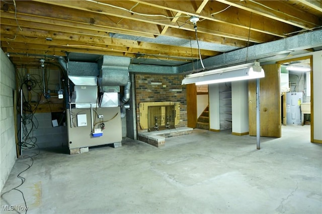 3763 E River Rd, Newton Falls, OH 44444 - unfinished basement with stairs, heating unit, and electric water heater