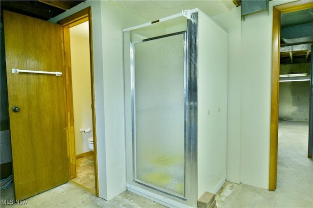 3763 E River Rd, Newton Falls, OH 44444 - bathroom with unfinished concrete flooring, toilet, and a stall shower