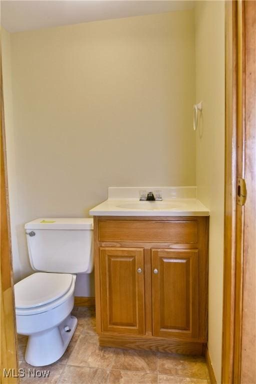 3763 E River Rd, Newton Falls, OH 44444 - half bath featuring vanity, toilet, and baseboards