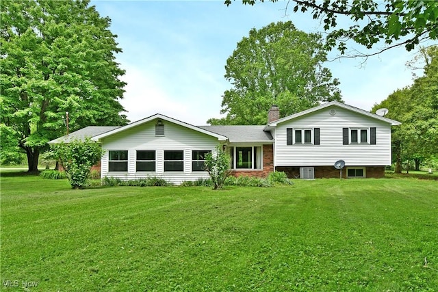 3763 E River Rd, Newton Falls, OH 44444 - rear view of property with a chimney, a lawn, and central AC