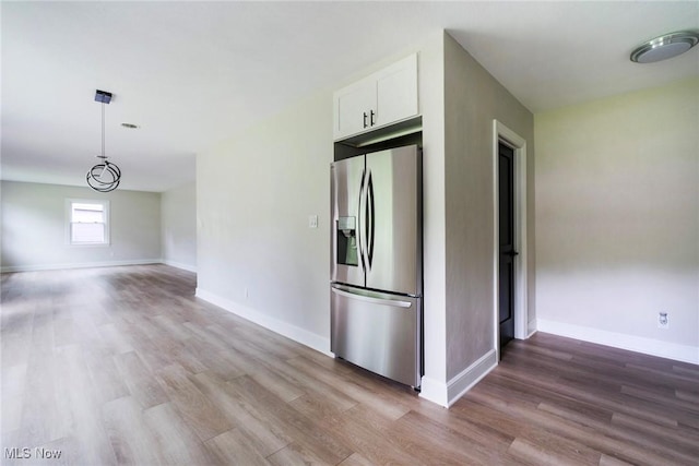 351 Cranberry Run, Boardman, OH 44512 - kitchen with stainless steel refrigerator with ice dispenser, light wood-style floors, white cabinetry, and baseboards