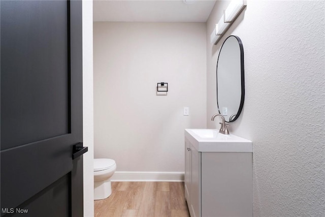 351 Cranberry Run, Boardman, OH 44512 - bathroom featuring vanity, toilet, wood finished floors, and baseboards