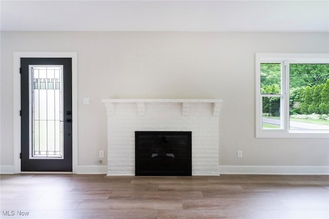 351 Cranberry Run, Boardman, OH 44512 - unfurnished living room featuring baseboards, a fireplace, and wood finished floors
