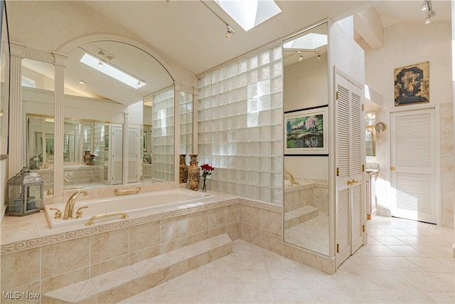 30699 Gates Mills Blvd, Pepper Pike, OH 44124 - full bath featuring a skylight, lofted ceiling, a garden tub, tile patterned flooring, and a closet