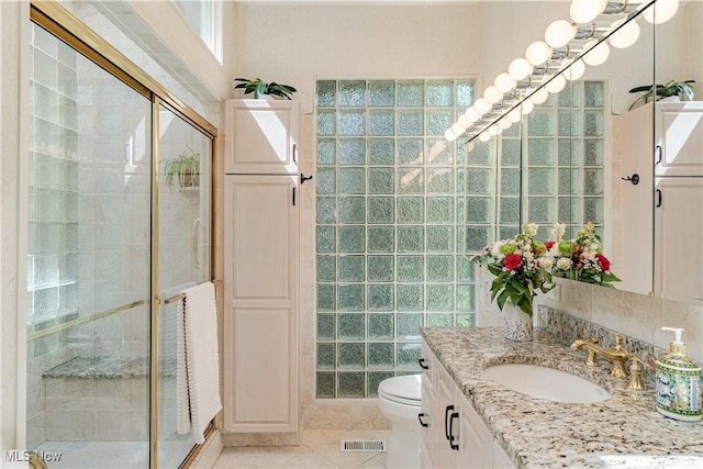 30699 Gates Mills Blvd, Pepper Pike, OH 44124 - full bathroom featuring vanity, a stall shower, toilet, and tile patterned flooring