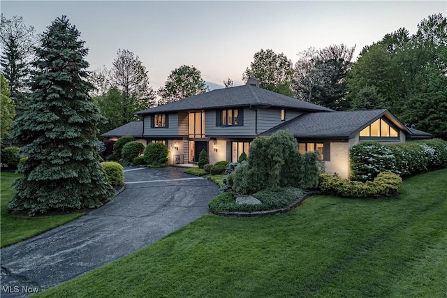 30699 Gates Mills Blvd, Pepper Pike, OH 44124 - view of front facade featuring asphalt driveway, a front lawn, and a chimney