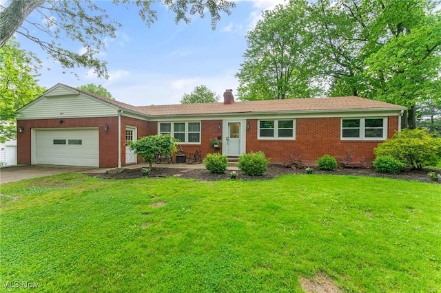 395 Overbrook Dr, Canfield, OH 44406 - ranch-style home with brick siding, an attached garage, concrete driveway, a chimney, and a front lawn