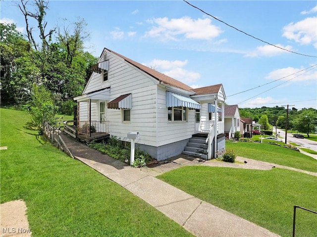 121 Valley Way, Weirton, WV 26062 - view of side of home featuring a lawn and roof with shingles