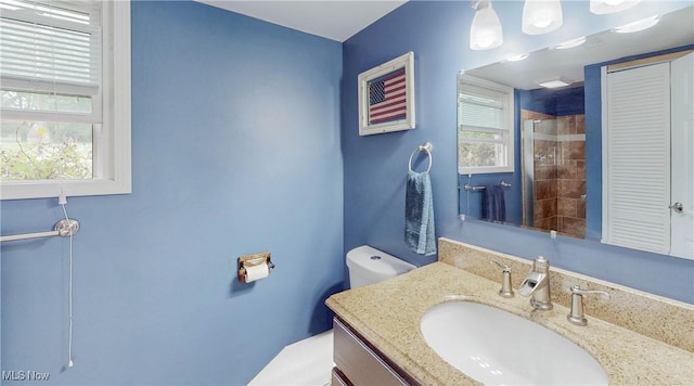 1379 S Polen Ave, Mogadore, OH 44260 - bathroom featuring toilet, a tile shower, and vanity