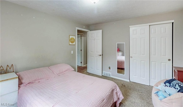 1379 S Polen Ave, Mogadore, OH 44260 - bedroom featuring carpet flooring, a closet, and a textured ceiling