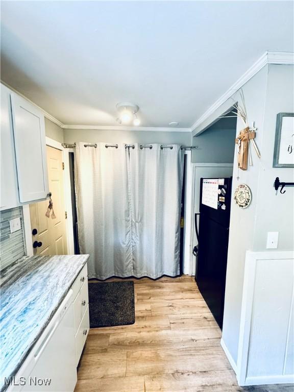 156 N Beverly, Austintown, OH 44515 - kitchen featuring freestanding refrigerator, white dishwasher, white cabinets, light wood-style floors, and light countertops