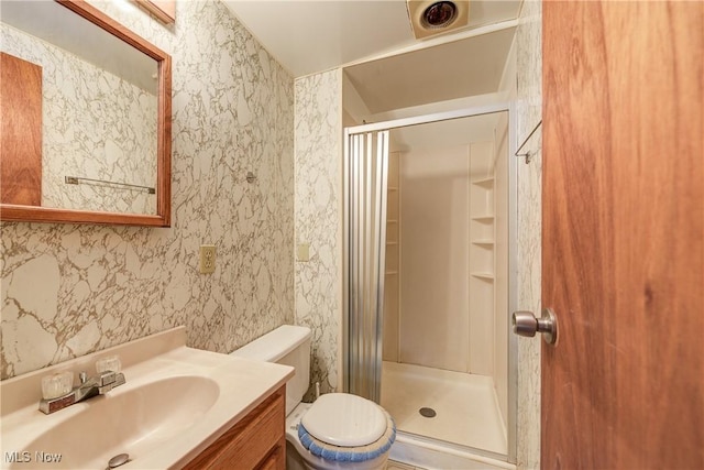 44 W Vine St, Oberlin, OH 44074 - full bath with a shower stall, vanity, toilet, and wallpapered walls