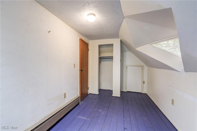 44 W Vine St, Oberlin, OH 44074 - bonus room featuring a textured ceiling, dark wood finished floors, and a baseboard heating unit