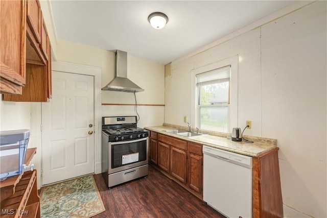 44 W Vine St, Oberlin, OH 44074 - kitchen with dishwasher, gas stove, wall chimney exhaust hood, a sink, and brown cabinets