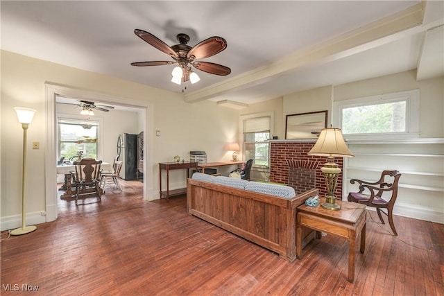 44 W Vine St, Oberlin, OH 44074 - living area with healthy amount of natural light, wood finished floors, beamed ceiling, and ceiling fan