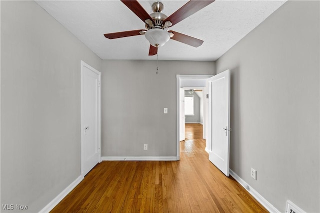 5688 Shawnee Dr, Lyndhurst, OH 44124 - unfurnished bedroom with wood finished floors, baseboards, and ceiling fan