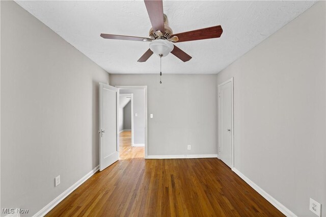 5688 Shawnee Dr, Lyndhurst, OH 44124 - spare room featuring wood finished floors, ceiling fan, and baseboards