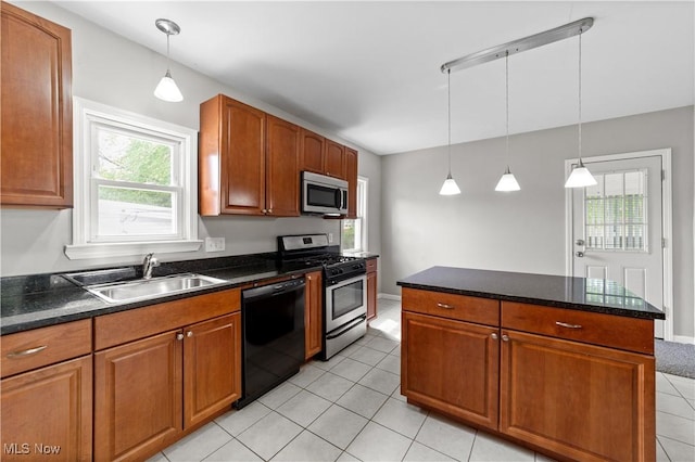 5688 Shawnee Dr, Lyndhurst, OH 44124 - kitchen with stainless steel appliances, a sink, light tile patterned flooring, and pendant lighting