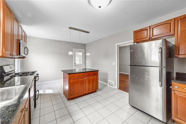 5688 Shawnee Dr, Lyndhurst, OH 44124 - kitchen featuring stainless steel appliances, light tile patterned floors, and brown cabinets