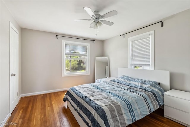 13641 Cedar Rd, University Heights, OH 44118 - bedroom with wood finished floors, baseboards, and a ceiling fan