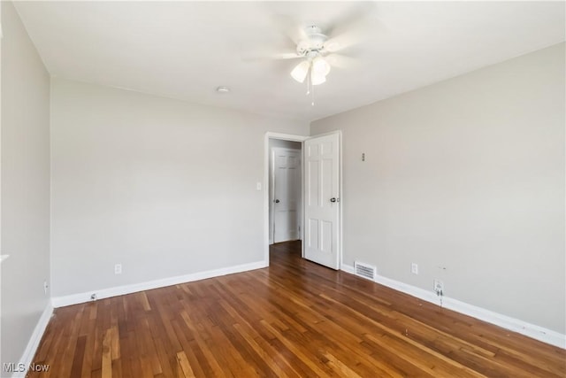 13641 Cedar Rd, University Heights, OH 44118 - unfurnished room featuring hardwood / wood-style floors, a ceiling fan, and baseboards