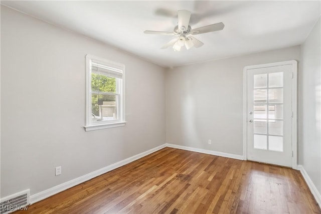 13641 Cedar Rd, University Heights, OH 44118 - unfurnished room featuring wood finished floors, baseboards, and a ceiling fan