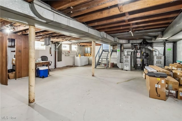 13641 Cedar Rd, University Heights, OH 44118 - basement featuring gas water heater, independent washer and dryer, stairway, and heating unit