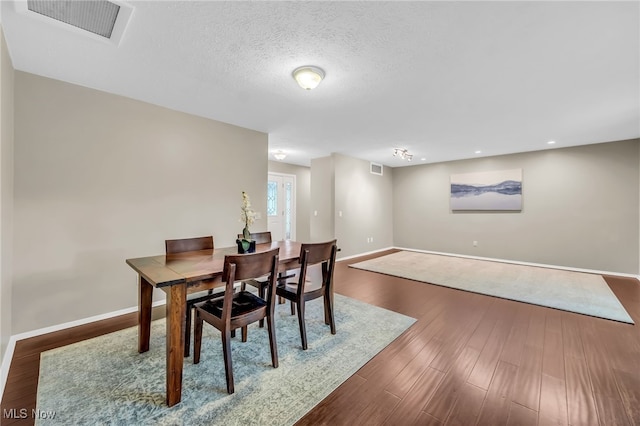 17404 Falling Water Rd, Strongsville, OH 44136 - dining room with baseboards, wood finished floors, and recessed lighting