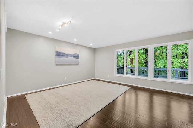17404 Falling Water Rd, Strongsville, OH 44136 - unfurnished room with baseboards, recessed lighting, and dark wood finished floors