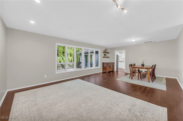 17404 Falling Water Rd, Strongsville, OH 44136 - dining room featuring wood finished floors, baseboards, and recessed lighting