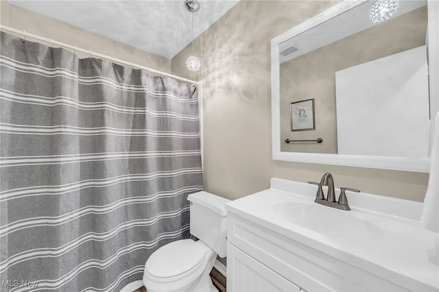 17404 Falling Water Rd, Strongsville, OH 44136 - bathroom with vanity, toilet, and a shower with shower curtain