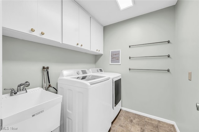 17404 Falling Water Rd, Strongsville, OH 44136 - laundry room with cabinet space, baseboards, and separate washer and dryer