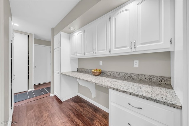 17404 Falling Water Rd, Strongsville, OH 44136 - kitchen featuring dark wood-style floors, white cabinets, light stone counters, recessed lighting, and baseboards