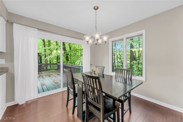 17404 Falling Water Rd, Strongsville, OH 44136 - dining room featuring plenty of natural light, wood finished floors, baseboards, and a chandelier