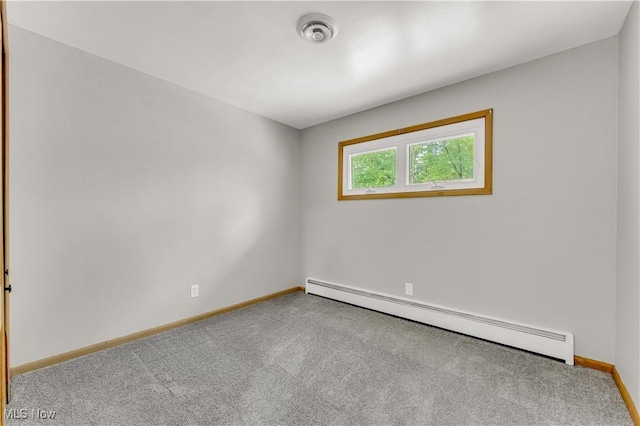 10701 Mountview Ave, Garfield Heights, OH 44125 - spare room featuring baseboard heating, carpet flooring, and baseboards