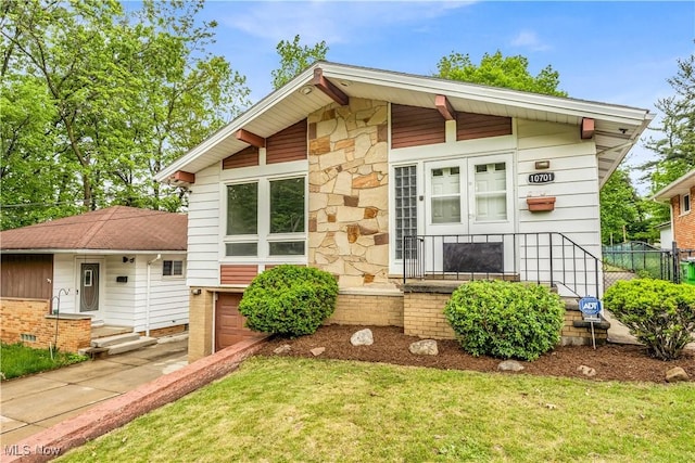 10701 Mountview Ave, Garfield Heights, OH 44125 - view of front of home with concrete driveway and stone siding