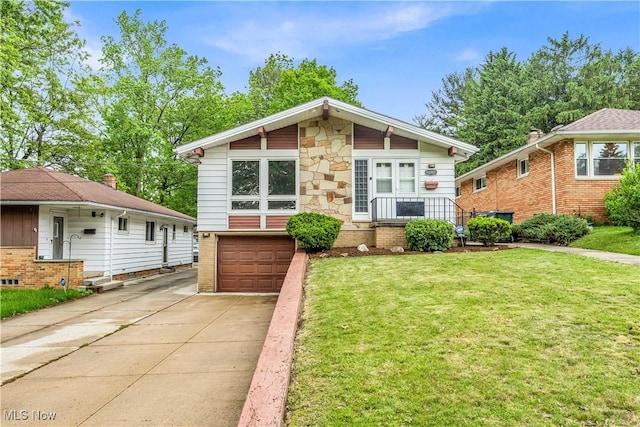 10701 Mountview Ave, Garfield Heights, OH 44125 - view of front of property featuring driveway, a front yard, an attached garage, brick siding, and stone siding