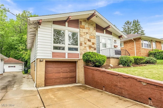 10701 Mountview Ave, Garfield Heights, OH 44125 - view of front of property featuring brick siding, a garage, stone siding, and a front lawn