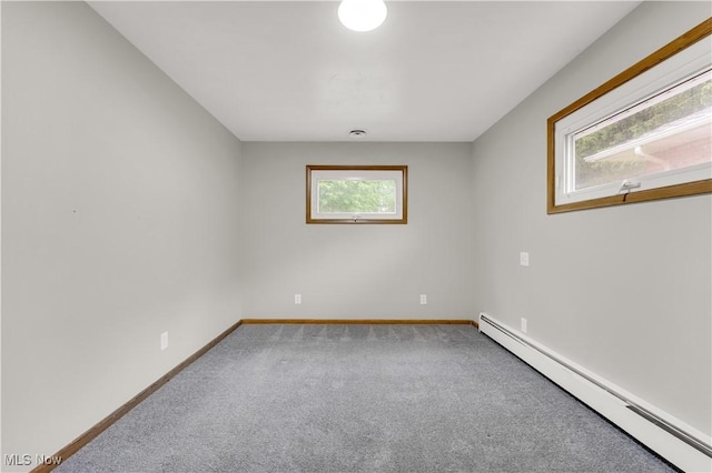 10701 Mountview Ave, Garfield Heights, OH 44125 - unfurnished room featuring baseboard heating, carpet, and baseboards