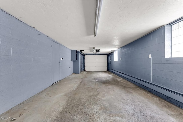10701 Mountview Ave, Garfield Heights, OH 44125 - garage featuring a baseboard heating unit