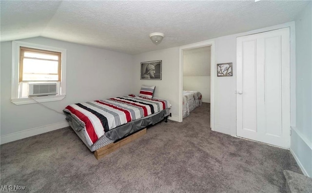 410 E Main St, Lakeside-Marblehead, OH 43440 - bedroom with cooling unit, carpet flooring, a textured ceiling, lofted ceiling, and baseboards