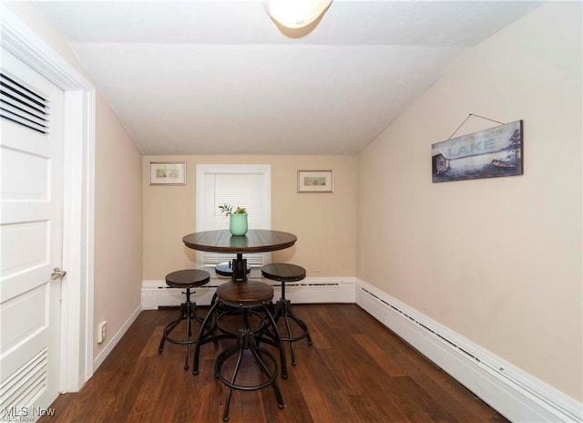 410 E Main St, Lakeside-Marblehead, OH 43440 - dining area featuring baseboard heating, dark wood-type flooring, and baseboards