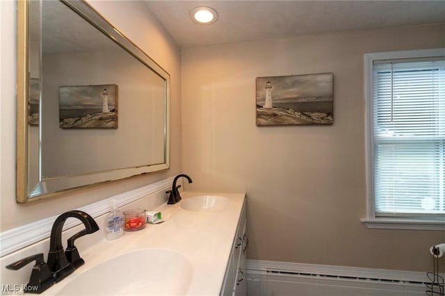 410 E Main St, Lakeside-Marblehead, OH 43440 - full bathroom with a baseboard heating unit, double vanity, and recessed lighting