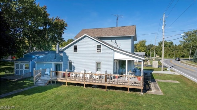 410 E Main St, Lakeside-Marblehead, OH 43440 - rear view of house with a yard and a deck