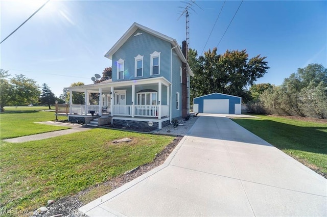 410 E Main St, Lakeside-Marblehead, OH 43440 - view of front facade with covered porch, a detached garage, an outbuilding, and a front yard