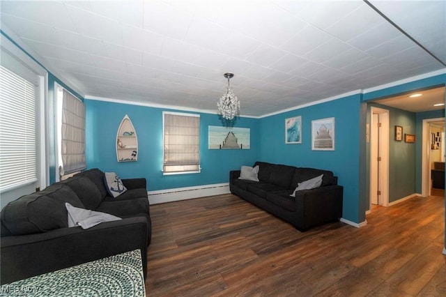 410 E Main St, Lakeside-Marblehead, OH 43440 - living room with baseboard heating, wood finished floors, a chandelier, baseboards, and crown molding