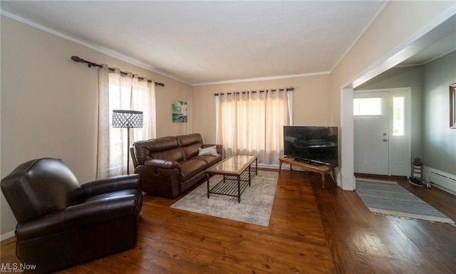 410 E Main St, Lakeside-Marblehead, OH 43440 - living room featuring wood-type flooring, crown molding, plenty of natural light, and a baseboard heating unit