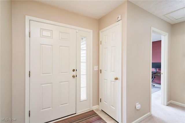 1917 Northgate Cir, Akron, OH 44320 - entryway with baseboards, light colored carpet, and a textured ceiling
