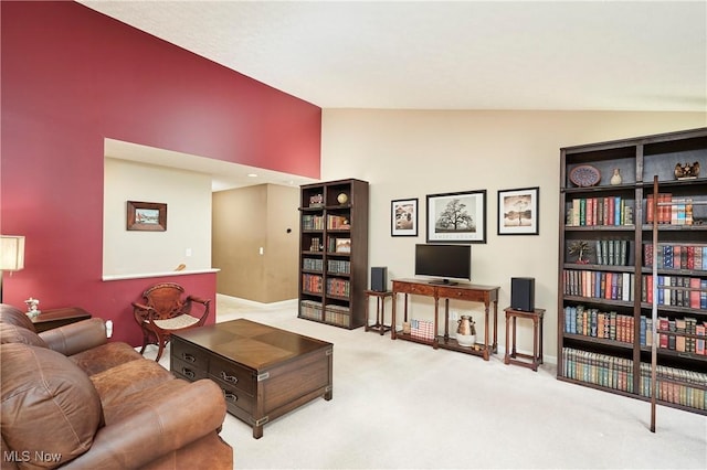 1917 Northgate Cir, Akron, OH 44320 - carpeted living room with baseboards and high vaulted ceiling